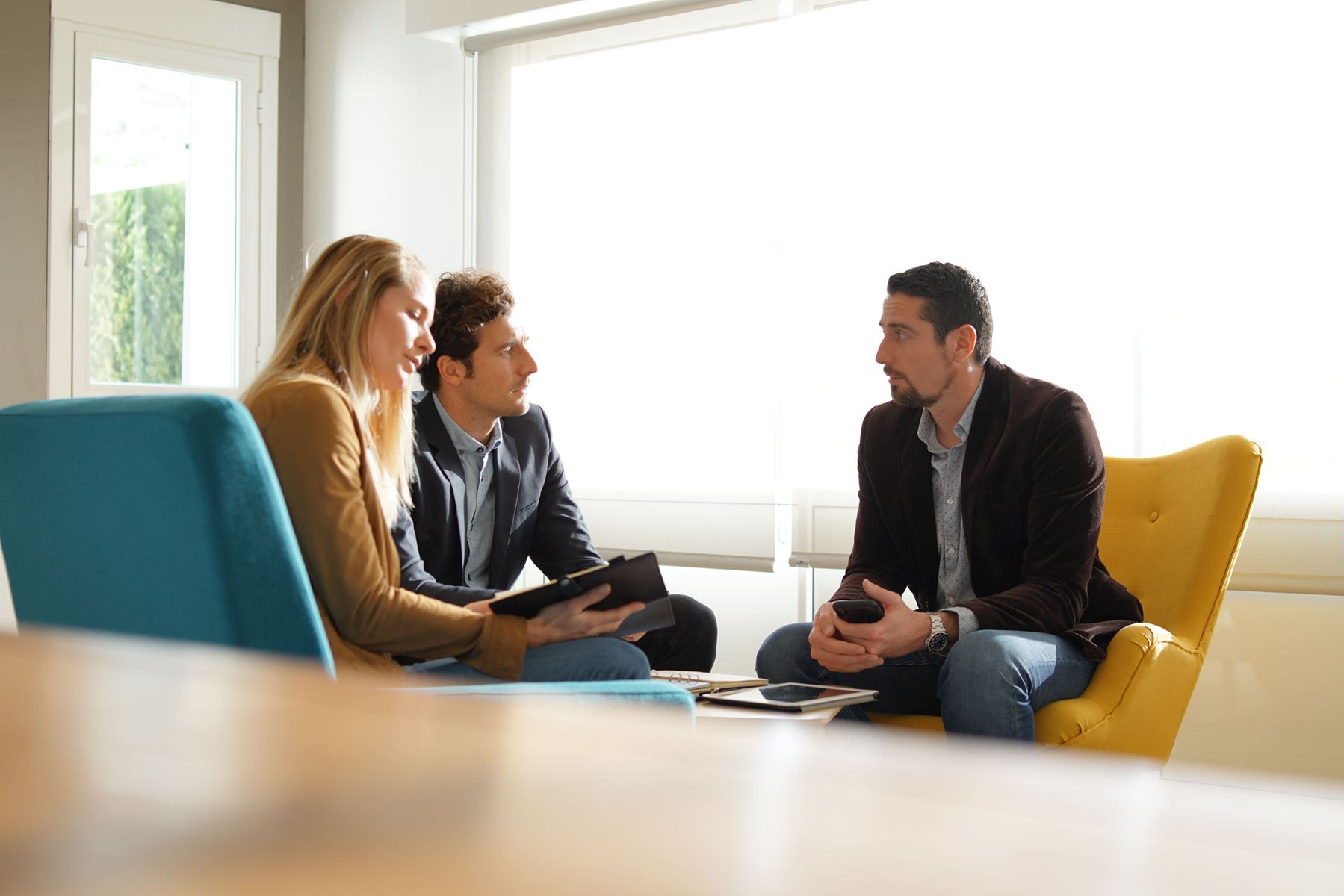 Business clients listening to man